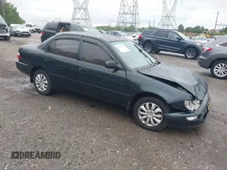 1997 Toyota Corolla with VIN 2T1BA02E2VC211034, listed as a IAAI auction lot 42253359 with 201,451 mi miles and . Bid and sale history available at DreamBid. Image 1.