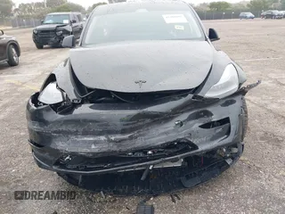 2024 Tesla Model Y with VIN 7SAYGDED8RF213927, listed as a IAAI auction lot 41386687 with 3,599 mi miles and . Bid and sale history available at DreamBid. Image 6.