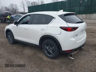 2021 Mazda CX-5 Touring with VIN JM3KFBCM1M1446313, listed as a IAAI auction lot 41930330 with 28,610 mi miles. Bid and sale history available at carsss.com. Image 3.