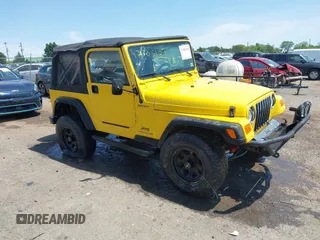 2005 Jeep Wrangler Sport z VIN 1J4FA49S65P381798, wystawiony jako IAAI lot #42305109 z przebiegiem 71 880 mil mil oraz . Historia ofert i sprzedaży dostępna na DreamBid. Obrazek 13.