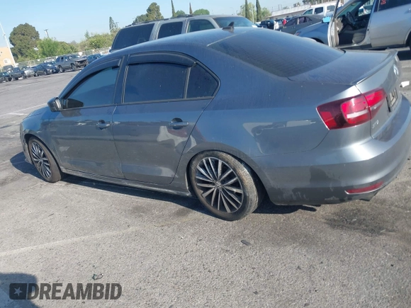 2016 Volkswagen Jetta Sport z VIN 3VWD17AJ0GM386504, wystawiony jako IAAI lot #42000125 z przebiegiem 90 405 mil mil oraz . Historia ofert i sprzedaży dostępna na DreamBid. Obrazek 14.