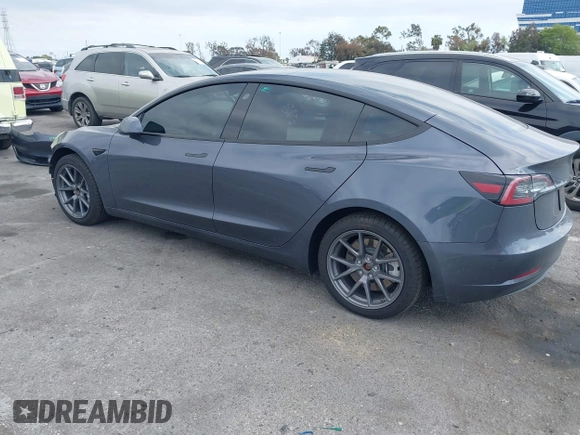 2023 Tesla Model 3 with VIN 5YJ3E1EA4PF410060, listed as a IAAI auction lot 42067624 with 59,934 mi miles and . Bid and sale history available at DreamBid. Image 3.
