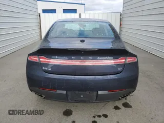 2013 Lincoln MKZ z VIN 3LN6L2GK4DR806669, wystawiony jako Copart lot #51239585 z przebiegiem 123 442 mil mil oraz Czysty tytuł • Clean title. Historia ofert i sprzedaży dostępna na DreamBid. Obrazek 6.