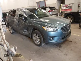2016 Mazda CX-5 Touring z VIN JM3KE4CY2G0839202, wystawiony jako IAAI lot #41901207 z przebiegiem 65 449 mil mil oraz . Historia ofert i sprzedaży dostępna na DreamBid. Obrazek 1.