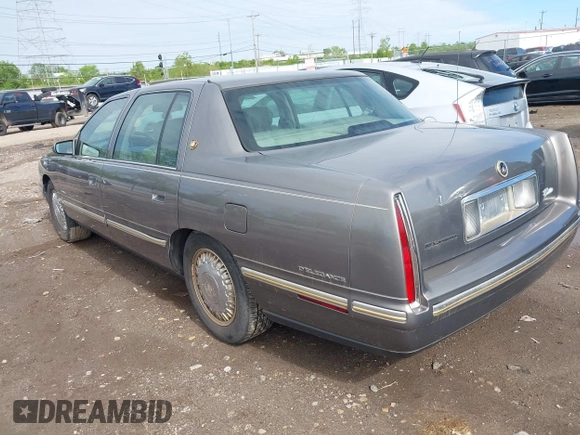 1999 Cadillac DeVille DHS z VIN 1G6KE54Y2XU752599, wystawiony jako IAAI lot #42141950 z przebiegiem 135 999 mil mil oraz . Historia ofert i sprzedaży dostępna na DreamBid. Obrazek 3.