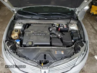 2015 Lincoln MKZ z VIN 3LN6L2GK4FR613117, wystawiony jako Copart lot #54141735 z przebiegiem 129 072 mil mil oraz Szkoda całkowita • Salvage title. Historia ofert i sprzedaży dostępna na DreamBid. Obrazek 11.