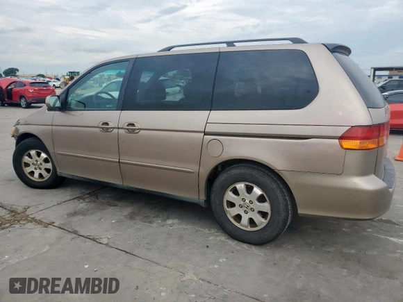 2004 Honda Odyssey EX-L with VIN 5FNRL18944B107051, listed as a Copart auction lot 58542335 with 207,951 mi miles and Salvage title. Bid and sale history available at DreamBid. Image 2.