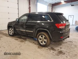 2012 Jeep Grand Cherokee Laredo with VIN 1C4RJFAT1CC225479, listed as a IAAI auction lot 41709911 with 227,150 mi miles. Bid and sale history available at carsss.com. Image 3.