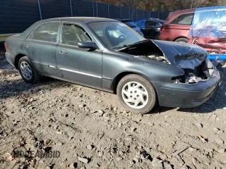 2002 Mazda 626 LX with VIN 1YVGF22D225276396, listed as a Copart auction lot 78723644 with 129,595 mi miles and Salvage Title. Bid and sale history available at carsss.com. Image 4.