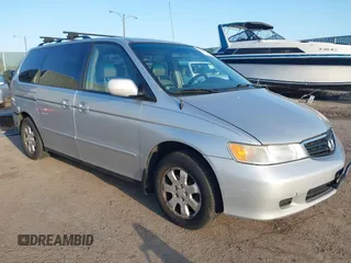 2003 Honda Odyssey EX-L z VIN 5FNRL18013B131176, wystawiony jako IAAI lot #41830437 z przebiegiem 88 226 mil mil oraz . Historia ofert i sprzedaży dostępna na DreamBid. Obrazek 1.