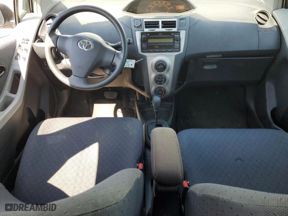 2009 Toyota Yaris with VIN JTDKT903695248767, listed as a Copart auction lot 52327265 with 211,184 mi miles and Salvage Title. Bid and sale history available at carsss.com. Image 8.