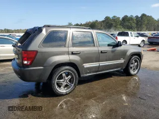 2006 Jeep Grand Cherokee Laredo with VIN 1J4HS48N96C357909, listed as a Copart auction lot 77551154 with 136,235 mi miles and Salvage Title. Bid and sale history available at carsss.com. Image 3.