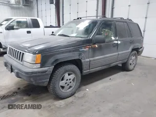 1995 Jeep Grand Cherokee Laredo with VIN 1J4GZ58S6SC765863, listed as a IAAI auction lot 41797726 with 234,715 mi miles and . Bid and sale history available at DreamBid. Image 2.