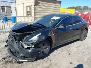 2019 Tesla Model 3 Mid Range with VIN 5YJ3E1EA2KF306286, listed as a IAAI auction lot 41699127 with 56,249 mi miles and . Bid and sale history available at DreamBid. Image 17.