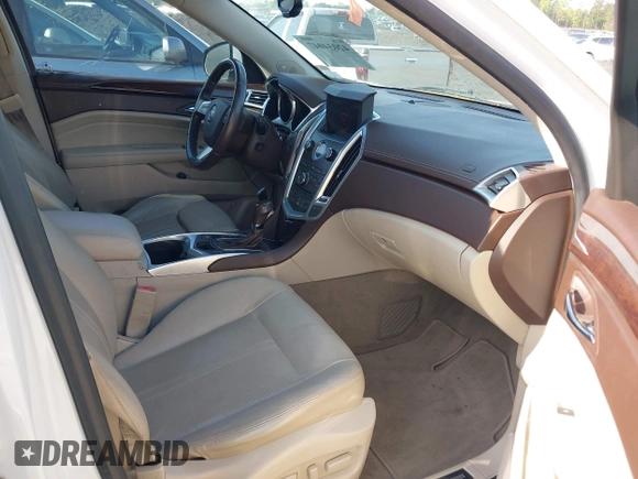 2011 Cadillac SRX Performance Collection with VIN 3GYFNBEYXBS540807, listed as a IAAI auction lot 42034047 with 198,429 mi miles. Bid and sale history available at carsss.com. Image 5.