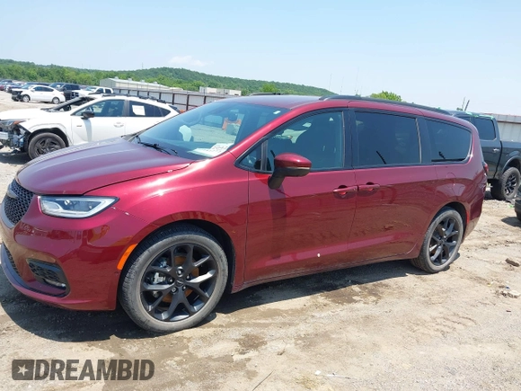 2023 Chrysler Pacifica Touring L with VIN 2C4RC1BG7PR513017, listed as a IAAI auction lot 42441272 with 23,310 mi miles and . Bid and sale history available at DreamBid. Image 14.