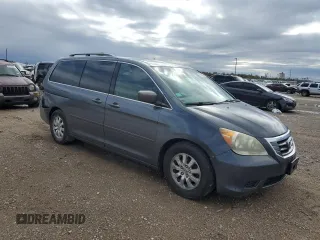 2010 Honda Odyssey EX-L with VIN 5FNRL3H72AB055070, listed as a Copart auction lot 80328974 with 221,467 mi miles and Salvage Title. Bid and sale history available at DreamBid. Image 4.