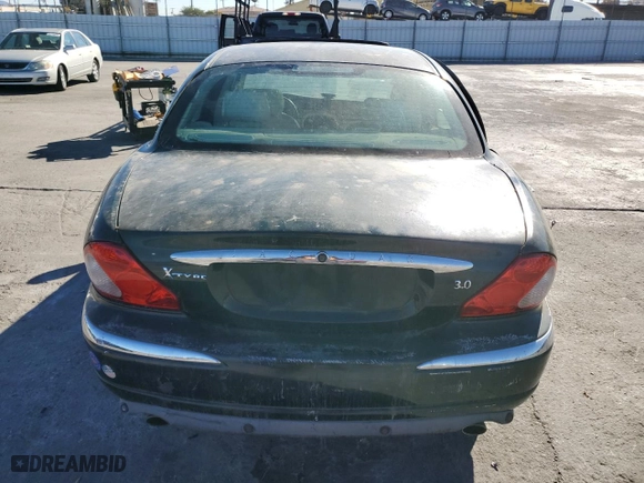 2002 Jaguar X-Type with VIN SAJEA51C12WC33477, listed as a Copart auction lot 83711124 with 165,637 mi miles and Salvage Title. Bid and sale history available at carsss.com. Image 6.