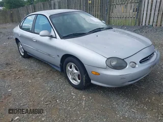1999 Ford Taurus SE Comfort z VIN 1FAFP53S8XG275509, wystawiony jako IAAI lot #42468822 z przebiegiem 86 391 mil mil oraz . Historia ofert i sprzedaży dostępna na DreamBid. Obrazek 1.