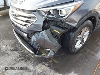 2018 Hyundai Santa Fe 2.4L with VIN 5XYZT3LB0JG525150, listed as a IAAI auction lot 42070377 with 142,418 mi miles and . Bid and sale history available at DreamBid. Image 6.