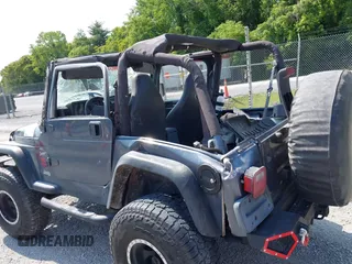 2001 Jeep Wrangler Sport z VIN 1J4FA49S11P322636, wystawiony jako IAAI lot #42409917 z przebiegiem 88 675 mil mil oraz . Historia ofert i sprzedaży dostępna na DreamBid. Obrazek 15.