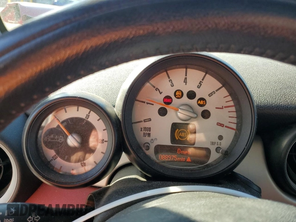 2013 MINI Convertible with VIN WMWZN3C58DT265980, listed as a Copart auction lot 77157154 with 88,975 mi miles and Salvage title. Bid and sale history available at DreamBid. Image 9.