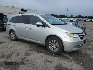 2014 Honda Odyssey EX-L with VIN 5FNRL5H62EB003236, listed as a Copart auction lot 63342255 with 147,398 mi miles and Salvage title. Bid and sale history available at DreamBid. Image 4.