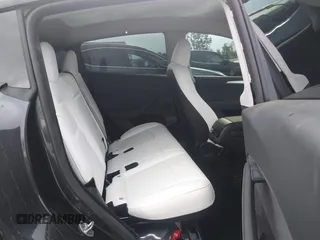 2024 Tesla Model Y with VIN 7SAYGDED8RF116209, listed as a IAAI auction lot 41761804 with 12,048 mi miles and . Bid and sale history available at DreamBid. Image 8.