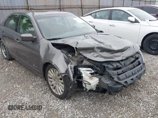 2011 Ford Fusion Hybrid with VIN 3FADP0L39BR345250, listed as a IAAI auction lot 42319401 with 321,317 mi miles and . Bid and sale history available at DreamBid. Image 6.