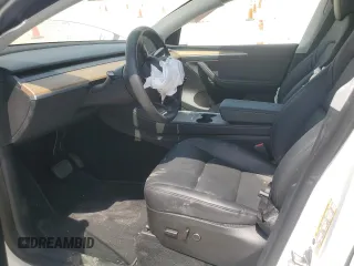 2023 Tesla Model Y Long Range z VIN 7SAYGDEE4PA064502, wystawiony jako Copart lot #53337645 z przebiegiem 16 945 mil mil oraz Szkoda całkowita • Salvage title. Historia ofert i sprzedaży dostępna na DreamBid. Obrazek 7.