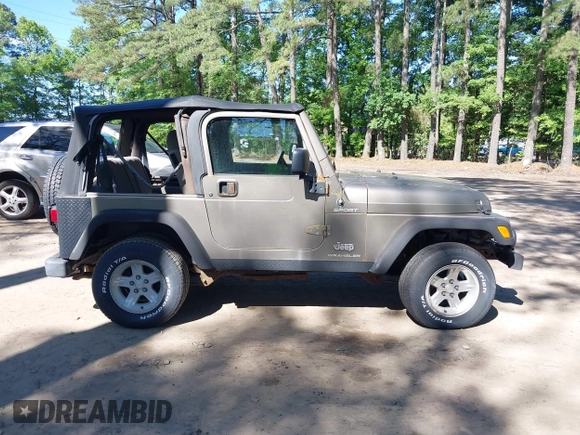 2003 Jeep Wrangler Sport with VIN 1J4FA49S13P313180, listed as a IAAI auction lot 42349673 with 141,073 mi miles and . Bid and sale history available at DreamBid. Image 13.
