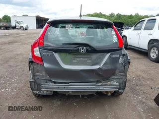 2015 Honda Fit LX z VIN 3HGGK5H59FM714352, wystawiony jako IAAI lot #42156097 z przebiegiem 103 587 mil mil oraz . Historia ofert i sprzedaży dostępna na DreamBid. Obrazek 6.