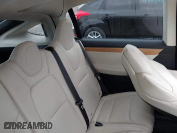 2018 Tesla Model X 75D with VIN 5YJXCAE2XJF111180, listed as a IAAI auction lot 41988079 with 114,593 mi miles and . Bid and sale history available at DreamBid. Image 8.