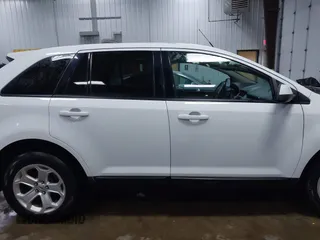 2014 Ford Edge SEL z VIN 2FMDK4JC9EBB06783, wystawiony jako IAAI lot #42047206 z przebiegiem 125 963 mil mil oraz . Historia ofert i sprzedaży dostępna na DreamBid. Obrazek 13.