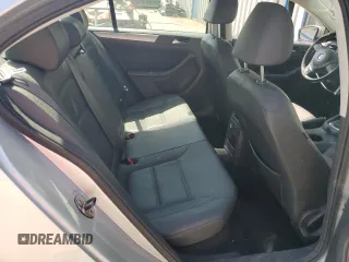 2012 Volkswagen Jetta TDI w/Premium & Nav z VIN 3VWLL7AJ9CM069918, wystawiony jako Copart lot #58237365 z przebiegiem 107 890 mil mil oraz Szkoda całkowita • Salvage title. Historia ofert i sprzedaży dostępna na DreamBid. Obrazek 10.