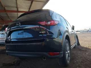 2021 Mazda CX-5 Grand Touring with VIN JM3KFBDM9M1395674, listed as a IAAI auction lot 41725822 with 1 mi miles. Bid and sale history available at carsss.com. Image 4.