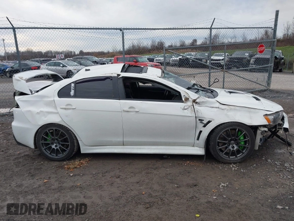 2014 Mitsubishi Lancer Evolution GSR with VIN JA32W8FV5EU012572, listed as a IAAI auction lot 40871463 with 89,529 mi miles. Bid and sale history available at carsss.com. Image 14.