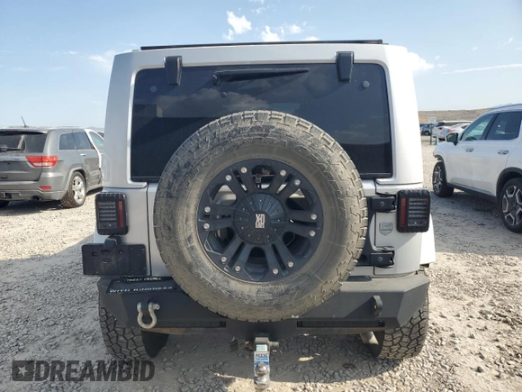 2012 Jeep Wrangler Unlimited Sahara z VIN 1C4HJWEG4CL159731, wystawiony jako Copart lot #59968695 z przebiegiem 111 918 mil mil oraz Szkoda całkowita • Salvage title. Historia ofert i sprzedaży dostępna na DreamBid. Obrazek 6.