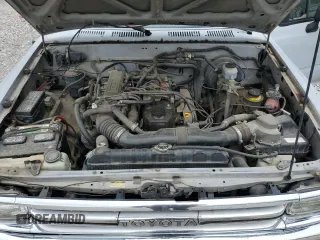1989 Toyota Pickup DX z VIN JT4RN81PXK0034338, wystawiony jako Copart lot #58797935 z przebiegiem 210 495 mil mil oraz Tytuł czysty. Historia ofert i sprzedaży dostępna na DreamBid. Obrazek 11.