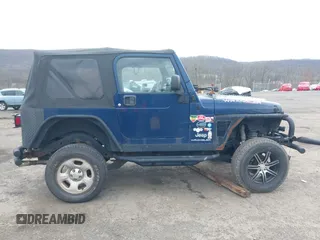 2004 Jeep Wrangler X with VIN 1J4FA39S64P780915, listed as a IAAI auction lot 42035524 with 131,057 mi miles. Bid and sale history available at carsss.com. Image 13.