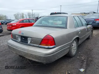 2003 Ford Crown Victoria LX z VIN 2FAFP74W13X120754, wystawiony jako IAAI lot #42212879 z przebiegiem 91 438 mil mil oraz . Historia ofert i sprzedaży dostępna na DreamBid. Obrazek 4.