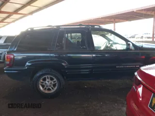 1999 Jeep Grand Cherokee Limited with VIN 1J4GW68N6XC675399, listed as a IAAI auction lot 41745815 with 217,800 mi miles. Bid and sale history available at carsss.com. Image 13.