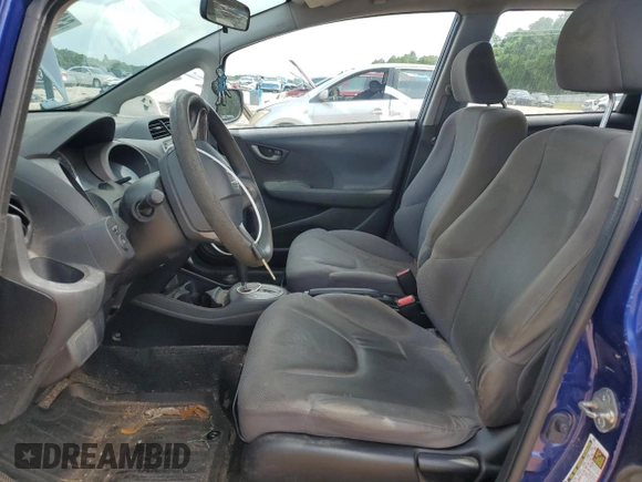 2009 Honda Fit with VIN JHMGE882X9S007865, listed as a Copart auction lot 61025875 with 159,919 mi miles and Clean title. Bid and sale history available at DreamBid. Image 7.