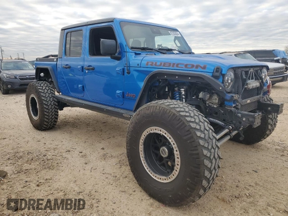 2021 Jeep Gladiator Rubicon with VIN 1C6JJTBM1ML611203, listed as a Copart auction lot 87203924 with 27,645 mi miles and Salvage title. Bid and sale history available at DreamBid. Image 4.