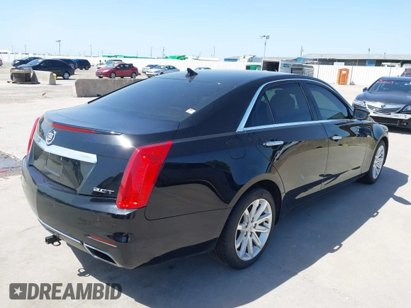 2014 Cadillac CTS Luxury RWD z VIN 1G6AR5SX3E0196348, wystawiony jako IAAI lot #42282732 z przebiegiem 130 956 mil mil oraz . Historia ofert i sprzedaży dostępna na DreamBid. Obrazek 4.