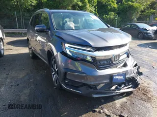 2021 Honda Pilot Touring 8-Passenger with VIN 5FNYF6H95MB048527, listed as a IAAI auction lot 42542138 with 40,584 mi miles and . Bid and sale history available at DreamBid. Image 17.