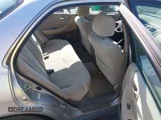1999 Honda Accord LX with VIN JHMCG6650XC011621, listed as a IAAI auction lot 42401527 with 243,227 mi miles and . Bid and sale history available at DreamBid. Image 8.