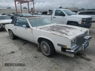 1984 Cadillac Eldorado z VIN 1G6AL5783EE654296, wystawiony jako Copart lot #74945374 z przebiegiem 37 040 mil mil oraz Szkody całkowita. Historia ofert i sprzedaży dostępna na DreamBid. Obrazek 4.