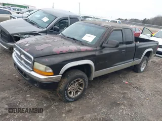 2001 Dodge Dakota SLT with VIN 1B7GG22XX1S255292, listed as a IAAI auction lot 41100133 with 168,454 mi miles and . Bid and sale history available at carsss.com. Image 2.