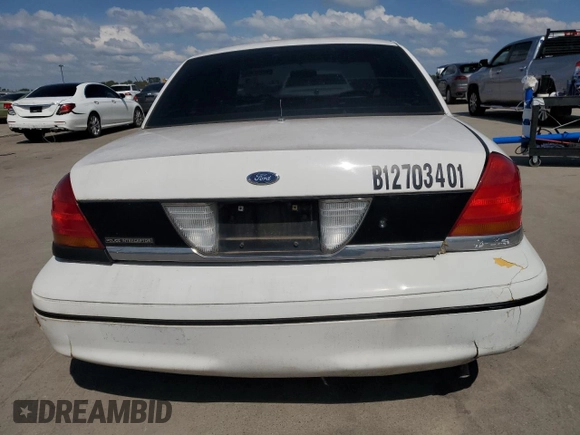 1999 Ford Crown Victoria Police z VIN 2FAFP71WXXX198735, wystawiony jako Copart lot #70526134 z przebiegiem 116 889 mil mil oraz Tytuł czysty. Historia ofert i sprzedaży dostępna na DreamBid. Obrazek 6.